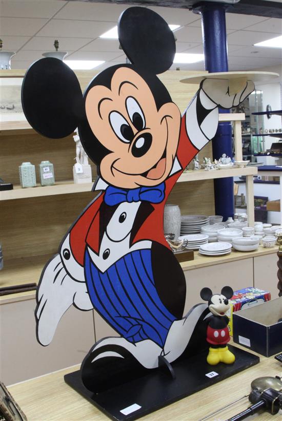A Walt Disney Mickey Mouse dumb waiter and a small squeezy toy